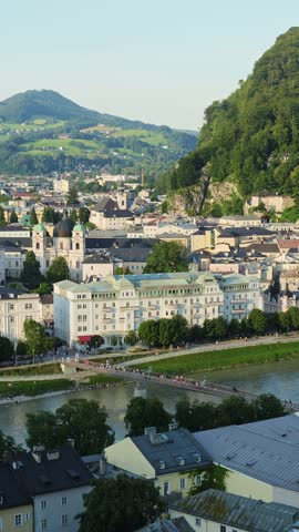 Salzburg Old Town on Sunny Summer Evening. Salzach River and Tourists on Bridge. Austria. Vertical Video