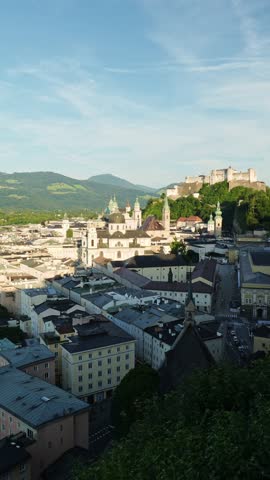 Salzburg Old Town and Hohensalzburg Fortress on Sunny Summer Evening. Austria. Vertical Video