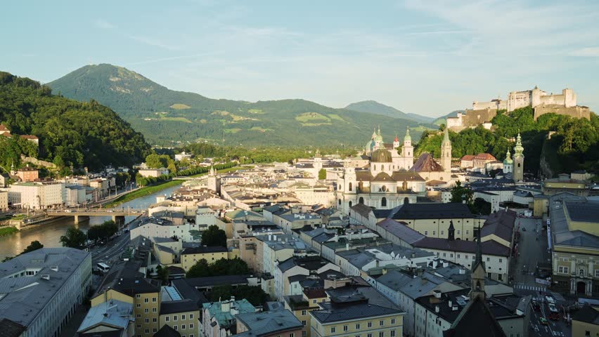 Salzburg Old Town and Hohensalzburg Fortress on Sunny Summer Evening. Salzach River. Austria