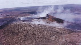  Drone footage captures the raw power of a Hawaii Island volcano at dusk, with glowing lava rivers cutting through dark volcanic rock under a dramatic, smoke-filled sky. - Powered by Shutterstock - Get 15% off with code: PIKWIZARD15