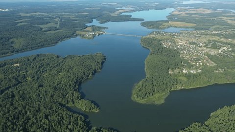 Drone Moving Backward over Forest River
