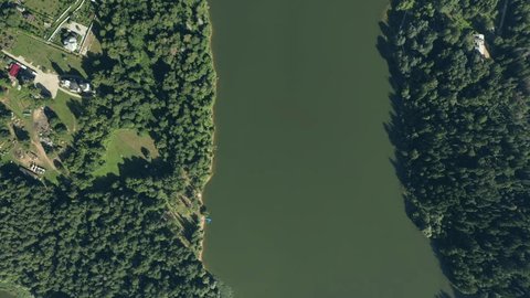 Aerial Drone Descent Along River in Summer