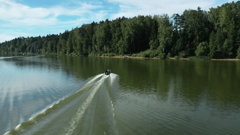 Speedboat Racing on River at Sunrise