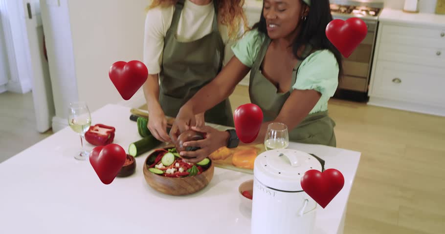 Kitchen assistant showing chopping tip guiding lead cook slicing veggies amid drifting red hearts. Cooking, culinary, teamwork, friendship, healthy eating, modern, lifestyle