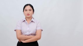 Confident Female Professional with Arms Crossed in Business Attire Standing Against Light - Powered by Shutterstock - Get 15% off with code: PIKWIZARD15