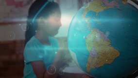 Girl studying globe tapping point activating data overlay writing geography notes in classroom. Education, learning, exploration, technology, academia, youth, stem - Powered by Shutterstock - Get 15% off with code: PIKWIZARD15