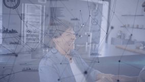 Senior woman tapping device presented by son in kitchen generating technology network overlay. Elderly, innovation, connectivity, intergenerational, contemporary, communication, lifestyle - Powered by Shutterstock - Get 15% off with code: PIKWIZARD15