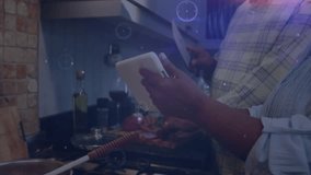 Senior couple scrolling tablet and cooking with tech animated overlay while chopping vegetables. Smart, contemporary, innovative, culinary, lifestyle, health, leisure - Powered by Shutterstock - Get 15% off with code: PIKWIZARD15