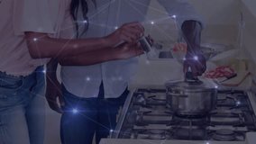 Grinding salt in saucepan for seasoning couple lifting lid adjusting knob and smiling at camera. Cooking, togetherness, domestic, culinary, lifestyle, modern, cheerful - Powered by Shutterstock - Get 15% off with code: PIKWIZARD15