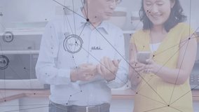 Senior man tapping phone screen, activating animated icons as colleague swiping in appliance demo. Technology, communication, companionship, collaboration, modern, digital, innovation - Powered by Shutterstock - Get 15% off with code: PIKWIZARD15