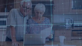 Arriving kitchen counter, senior couple reviewing financial documents on laptop and updating budget. Family, collaboration, technology, domestic, lifestyle, relaxation, nostalgia - Powered by Shutterstock - Get 15% off with code: PIKWIZARD15