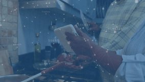 Senior couple using cooking recipe on tablet with animations as vegetables get chopped and sauteed. Cooking, collaboration, modern kitchen, culinary, leisure, lifestyle, technology - Powered by Shutterstock - Get 15% off with code: PIKWIZARD15