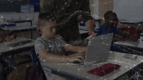 Student typing on laptop in classroom, teacher leaning forward pointing at screen guiding education. Education, mentorship, technology, learning, classroom, focus, collaboration - Powered by Shutterstock - Get 15% off with code: PIKWIZARD15