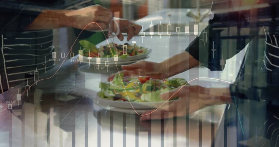 Picking up metal tongs cook in kitchen plating salad handing salad to server ensuring presentation. Cooking, culinary, professionalkitchen, teamwork, freshness, foodpresentation, vibrant