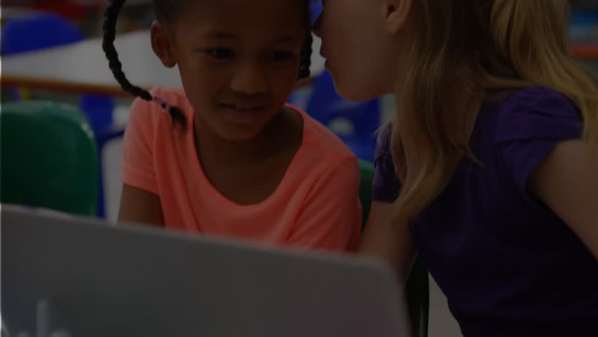 Right girl whispering idea into left girl ear, leaning over laptop and solving assignment. Collaboration, friendship, learning, classroom, teamwork, communication, youth - Powered by Shutterstock - Get 15% off with code: PIKWIZARD15