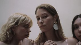 Women pose with young models for creative photoshoot in studio setting - Powered by Shutterstock - Get 15% off with code: PIKWIZARD15