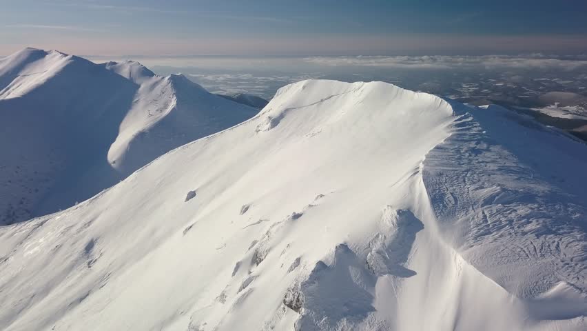 Aerial View of Frozen Winter Mountains, Snowy Ridge of Alps Landscape