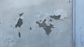 New building wall close-up with peeling paint and plaster cracks caused by poor construction quality - Powered by Shutterstock - Get 15% off with code: PIKWIZARD15