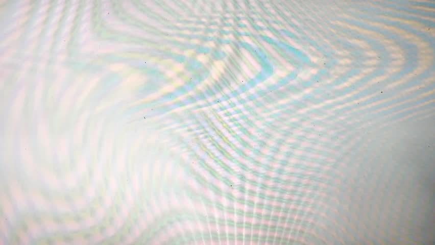Soft analog VHS signal with dreamy pastel distortion waves in blue and peach tones. Abstract glitch background ideal for creative video overlays