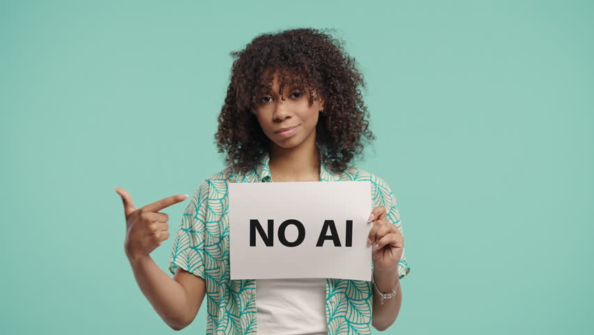 Pretty Woman Holds Sign No Ai With Serious Face, Studio Visual Protest on Blue