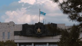 Kazakhstan flag is fluttering on the wind on top of a World War II Memorial in Panfilov Park, Almaty, Kazakhstan. Slow motion. High speed camera
 - Powered by Shutterstock - Get 15% off with code: PIKWIZARD15