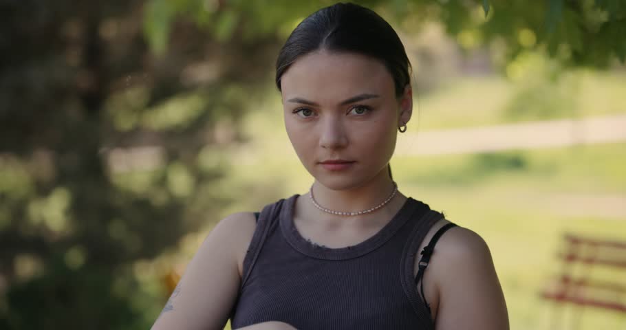 Woman photographer portrait make a photos in a park at summer day