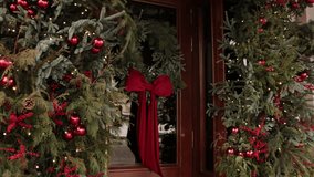 xmas wreath, Decorative element, christmas decorated. Festive front door adorned with pine wreath, red velvet bow, ornaments, berries, and holiday lights during Christmas season. - Powered by Shutterstock - Get 15% off with code: PIKWIZARD15