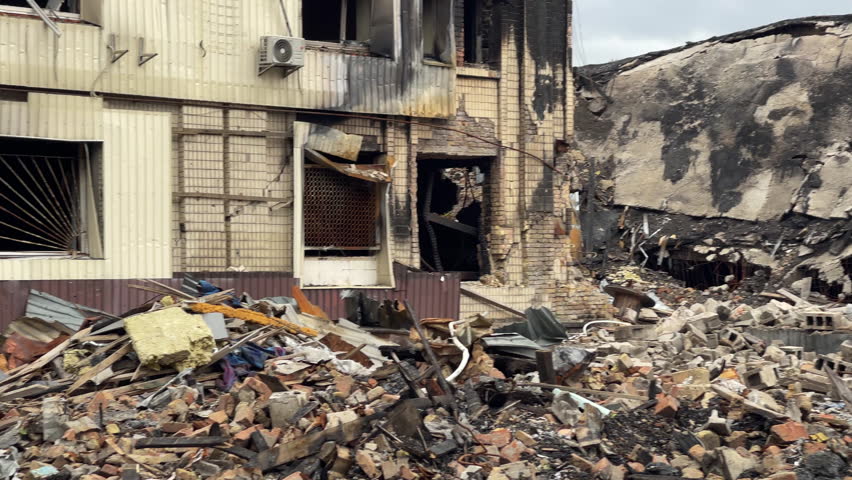 War in Ukraine: Destroyed industrial building in Kyiv, several months after a Russian missile or drone attack, with piles of rubble. October 2025
