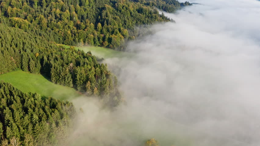 Peaceful Fog Over Lake Irrsee, Austria – 4K Aerial Drone Footage of Misty Hills and Mountains in Daylight