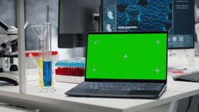 Isolated screen laptop in lab next to test tubes and microscope equipment. Mockup notebook in laboratory used to study DNA strand mapping with genomics analysis program, zoom out shot - Powered by Shutterstock - Get 15% off with code: PIKWIZARD15