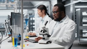 Laboratory scientist using computer to process DNA patient data, communicating results to coworkers. Lab expert uses PC to do lab genetic analysis diagnostics, sharing data with colleagues, camera B - Powered by Shutterstock - Get 15% off with code: PIKWIZARD15
