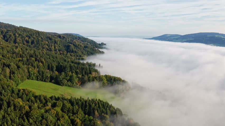 Peaceful Fog Over Lake Irrsee, Austria – 4K Aerial Drone Footage of Misty Hills and Mountains in Daylight
