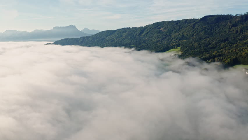 Peaceful Fog Over Lake Irrsee, Austria – 4K Aerial Drone Footage of Misty Hills and Mountains in Daylight