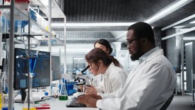 Senior researcher records observations from coworkers using microscope to evaluate cellular structures. Man taking notes of medical tissue observation through magnification tool, camera A - Powered by Shutterstock - Get 15% off with code: PIKWIZARD15