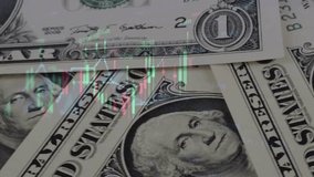 US dollar banknotes stacks over digital screen with exchange chart, depreciation and volatility concept, close-up perspective view - Powered by Shutterstock - Get 15% off with code: PIKWIZARD15