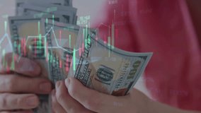 A person counting dollars, Financial data chart. Profit in US Dollars from Stock Market and Cryptocurrency Investments. Change and Volume. Crypto Concept and Bitcoin BTC Trading - Powered by Shutterstock - Get 15% off with code: PIKWIZARD15