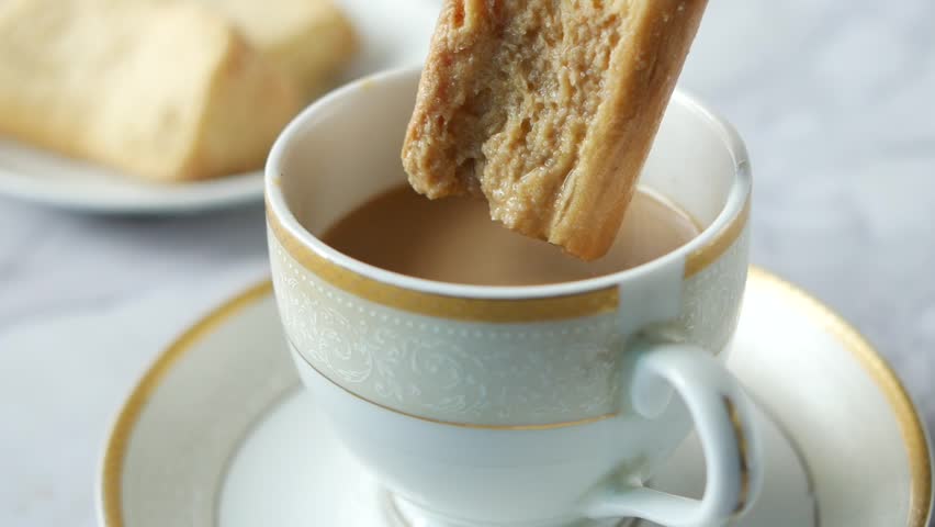 Biscotti Dipping in Coffee 4k