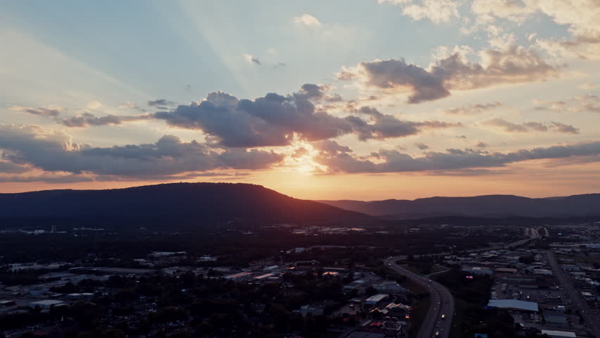 Timelapse of the golden sunset over Lookout Mountain near Chattanooga, Tennessee, with soft light casting over the hills and city below.
