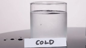 Colored dye disperses slowly in clear cold water, filmed in bright studio lighting, static camera - Powered by Shutterstock - Get 15% off with code: PIKWIZARD15