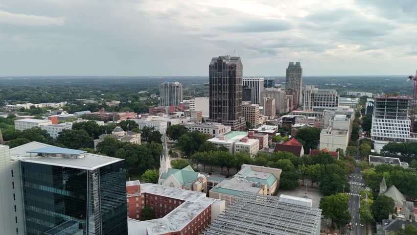 Downtown Raleigh skyline under dramatic evening sky
