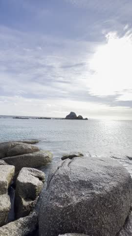 Vibrant view of the Bay of Fires in Tasmania, Australia, featuring orange rocks, turquoise ocean water, and white sandy beaches under a clear blue sky.