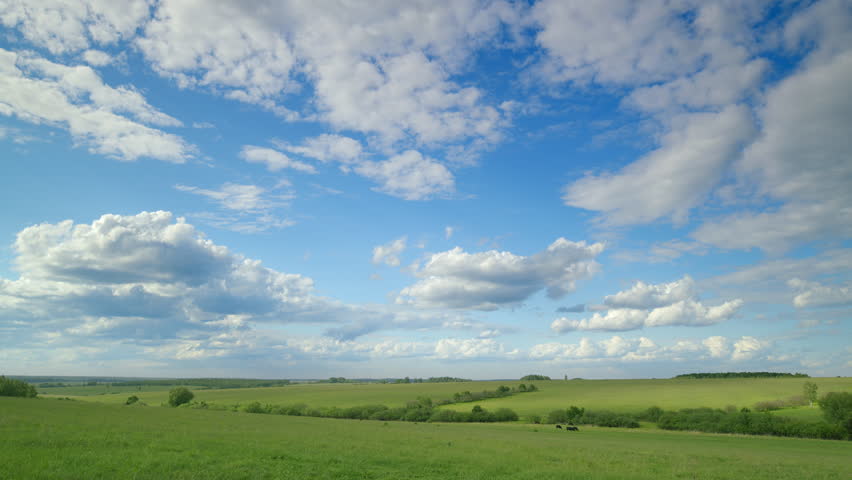 A Beautiful Serene Landscape Displaying Clear Blue Skies Alongside Fluffy White Clouds