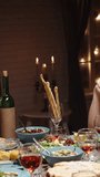 Vertical slow motion video hands exchanging gift boxes over festive dinner table concept christmas holiday celebration friendship gratitude joy cozy home warm light family gathering - Powered by Shutterstock - Get 15% off with code: PIKWIZARD15