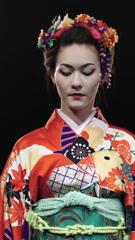 Japanese Geisha In Red Kimono With Golden Fans Performing Ritual Gesture Closing Face Then Turning In Profile Under Studio Light Representing Tradition Symbolism And Inner Strength Of Japanese Art