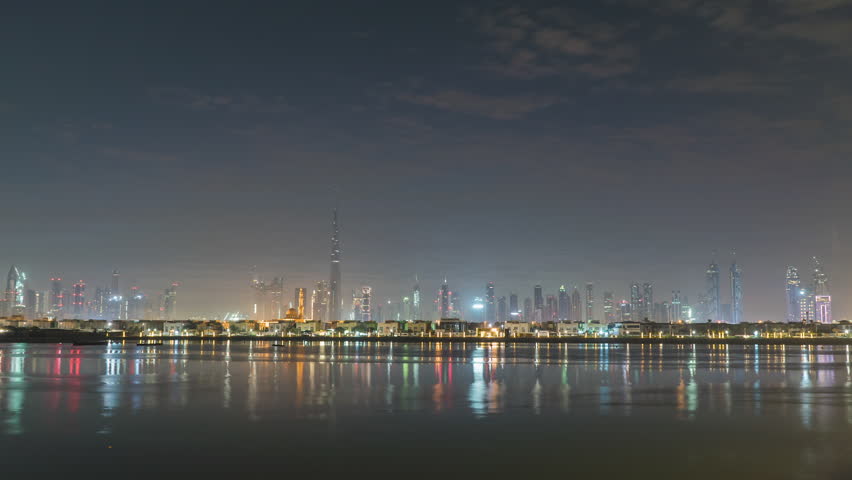 Sunrise in Dubai UAE, United Arab Emirates, dawn over skyscrapers in big city. Morning in Dubai, Sun over buildings. sundown, the sun sets behind the horizon in the city, pre-sunset time. Solar path