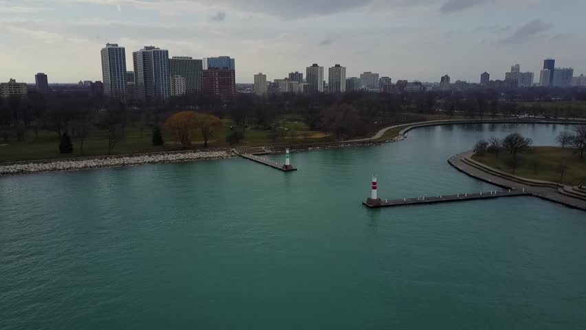 Aerial drone video of a lake harbor with two lighthouses  located north of Chicago, Illinois.