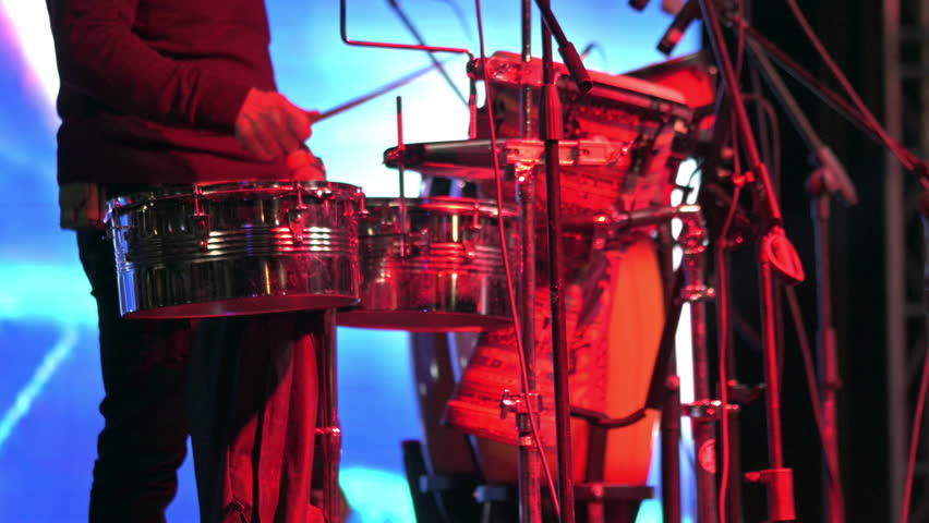 A band member plays the drums at a musical concert. Close-up 4K video of playing an analog drum set.