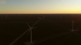 Aerial drone view of large wind turbines generating renewable energy in the vast Patagonian landscape of Argentina. - Powered by Shutterstock - Get 15% off with code: PIKWIZARD15