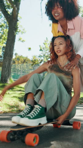 Energy, friends and push on skateboard at park with freedom, bonding activity and fashion. Adrenaline, gen z girls and skating with speed in road for weekend adventure, balance and streetwear style