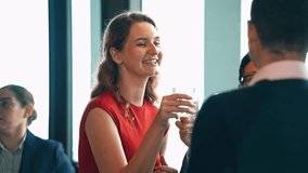 Businesspeople smiling, laughing and toasting drink with business partner at the company meeting on New year party. Corporate meeting or social gathering event with colleagues or customer. - Powered by Shutterstock - Get 15% off with code: PIKWIZARD15